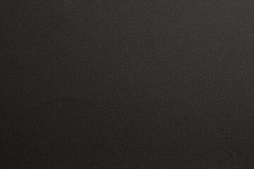 Close-up of dark sandpaper texture background
