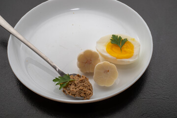 Fresh homemade veal liver pate, chicken pate on a white plate. Delicious homemade food. Options for a buffet.