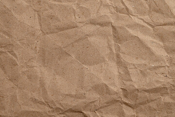 Wrinkled brown kraft paper texture background

