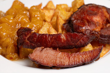 Smoked pork slices with roasted potatoes and stewed apples
