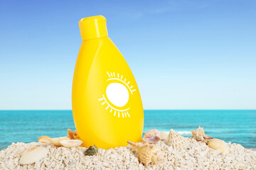 Sunscreen product in bottle with drawing of sun on beach