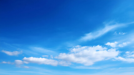 Clear blue sky with few white clouds, ample copy space, peaceful and bright atmosphere, perfect for backgrounds