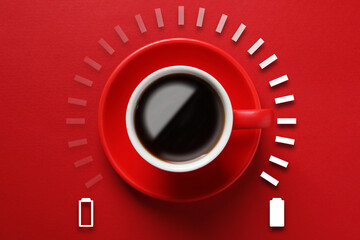 Cup of coffee and energy gauge on red background, top view. Low level battery becoming fully charged after caffeine consumption © New Africa