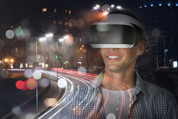Happy man using virtual reality headset, double exposure with cityscape