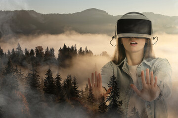 Woman using virtual reality headset, double exposure with mountain landscape