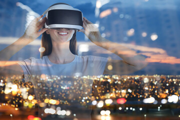 Happy woman using virtual reality headset, multiple exposure with cityscapes