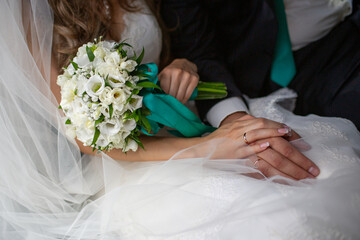 Bride and groom holding hands at wedding