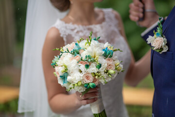Bride Holding Bouquet With Groom During Wedding Ceremony