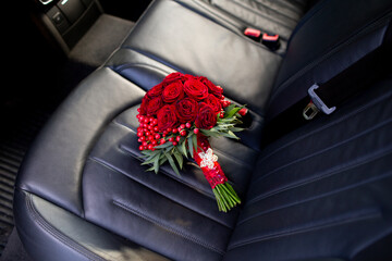 Red rose bouquet on a car seat