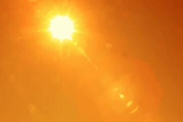 Bright sun in orange sky during hot summer weather. Extremely high temperature