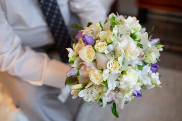 Groom Holding Elegant Wedding Bouquet