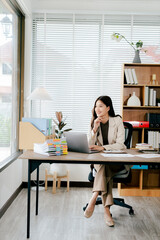 Portrait of a businesswoman working in an office, female consultant or secretary, female supervisor.