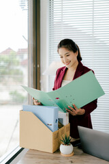 Female secretary holding file searching for documents in office. Young woman checking business documents, checking accounts, searching for documents, tax, accounting.