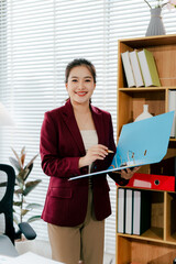 Asian business woman Business document check, account check, document search Legal documents, document preparation, reports, tax analysis, time, accounting, data sheets