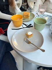 Friends Having Dessert and Coffee at Café Table