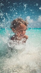 Close-up of a laughing child splashing in turquoise sea water, droplets frozen mid-air, white sand background