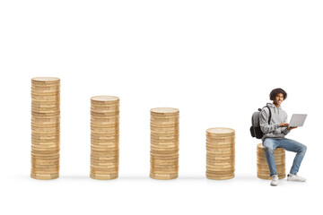 African american student with a laptop computer sitting on a pile of coins, it industry concept