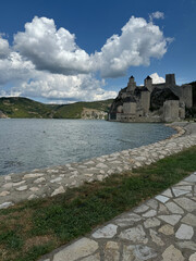 Golubac Fortress (Golubacka trvdjava, or Goluback Grad) taken during a sunny afternoon with windmills in background. The Golubac Castle was a medieval fortified town on the Danube River in Serbia