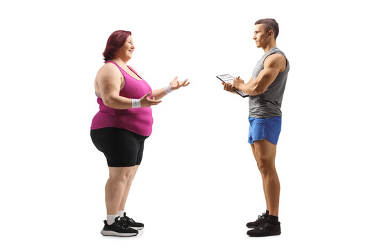 Full length profile shot of an overweight woman talking to a fitness coach - Powered by Adobe