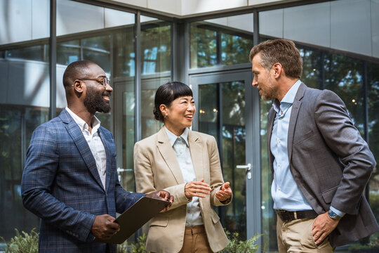 Multicultural business team having a discussion outdoor
