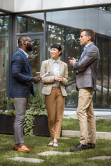 Multicultural business team having a discussion outdoor