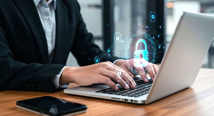 A person typing on a laptop with security lock icons and a phone on the table near the computer