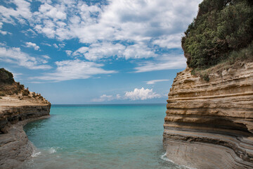 Greece island Corfu the concept of recreation and wellness for children and adults to breathe the sea air, take natural vitamin D from the sun lying under the blue sky or making a water voyage on a