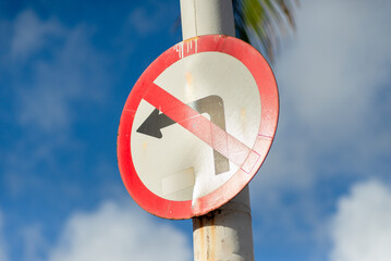 Traffic sign indicating that it is forbidden to turn left. Transport signage.