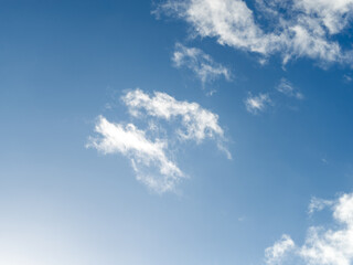 White clouds in the blue sky. Space. Background.