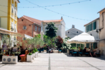 Fototapeta premium Blurred abstract background of outdoor cafe in Mediterranean town