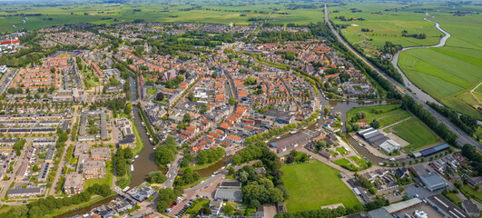 An panorama Aerial view of the old town of the  city Bolsward in the Netherlands on a sunny day in summer.	
