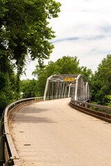 Fototapeta premium Devils Elbow, Missouri, USA - June 17th 2025 - The historic 1923 Devils Elbow Bridge over the Big Piney River on Route 66.