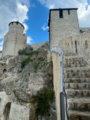 Golubac Fortress (Golubacka trvdjava, or Goluback Grad) taken during a sunny afternoon with windmills in background. The Golubac Castle was a medieval fortified town on the Danube River in Serbia