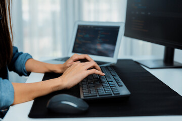 Cropped hands image of IT developer creating with typing information on pc with coding program...