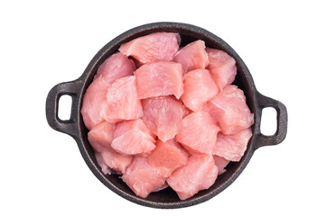 Raw turkey fillet pieces, diced poultry breast meat in a skillet isolated on white background. top...