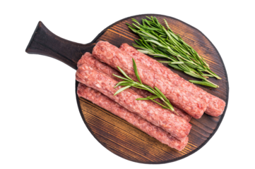 Fresh raw beef and lamb meat kebabs sausages  on wooden board isolated on white background. top view