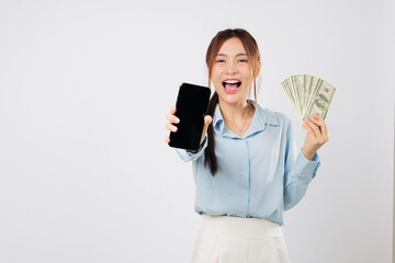 Smiling happy woman showing phone screen and holding money, mobile online app money gain representing financial success and digital achievement with confidence. isolated studio white background