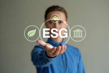 Person holding esg acronym with icons for environment social and governance in a futuristic interface concept