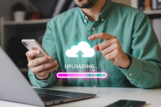 Man using smartphone and laptop to upload files to the cloud with a progress bar and cloud icon