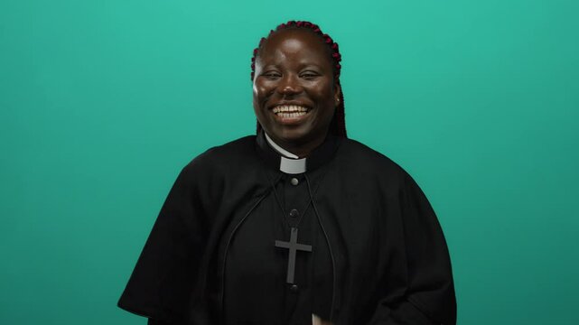 Priest smiling woman african collar clerical cross isolated green background wall clergy ordained female religious expression