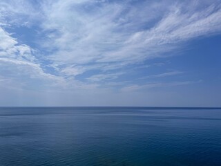 Calm ocean and cloudy sky.