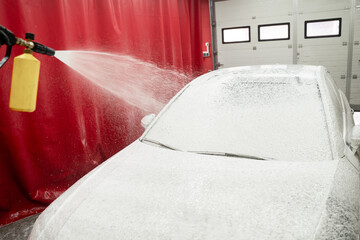 High-pressure snow foam application ensures deep cleaning and softens grime on car surface. Car...