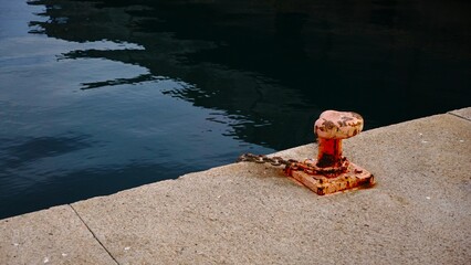 oxidized metallic mooring in empty port