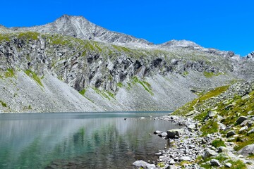 View of Säuleck mountain peak above Dösner alpine lake in High Tauern mountains, Carinthia, Austria
