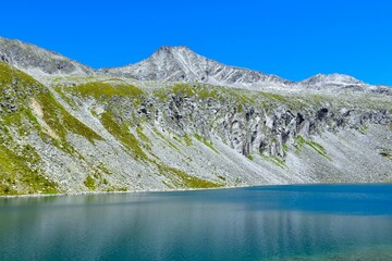 View of Säuleck peak in High Tauern mountains above Dösner lake in Carinthia, Austria