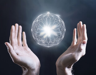 Hands opening to reveal a glowing sacred geometry orb