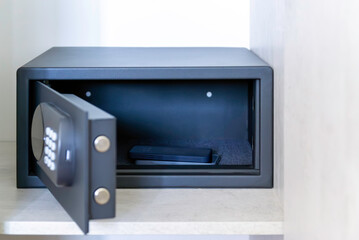 Open Safe with Smartphone Inside – Hotel or Home Security Concept. secure storage, personal data...