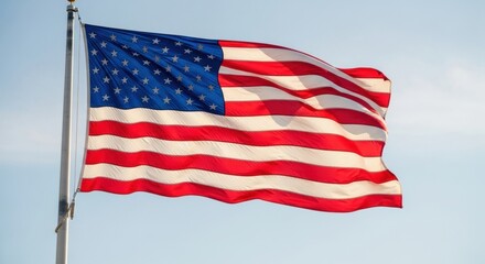 Large American Flag Waving Under a Bright Blue Sky