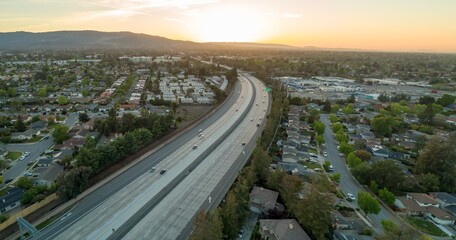 Aerial view of Interstate 280 highway running through Cupertino neighborhood in California, USA, at...