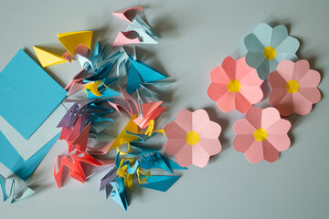 scraps of colored paper on a blue background top view. paper craft for kids. create art for...